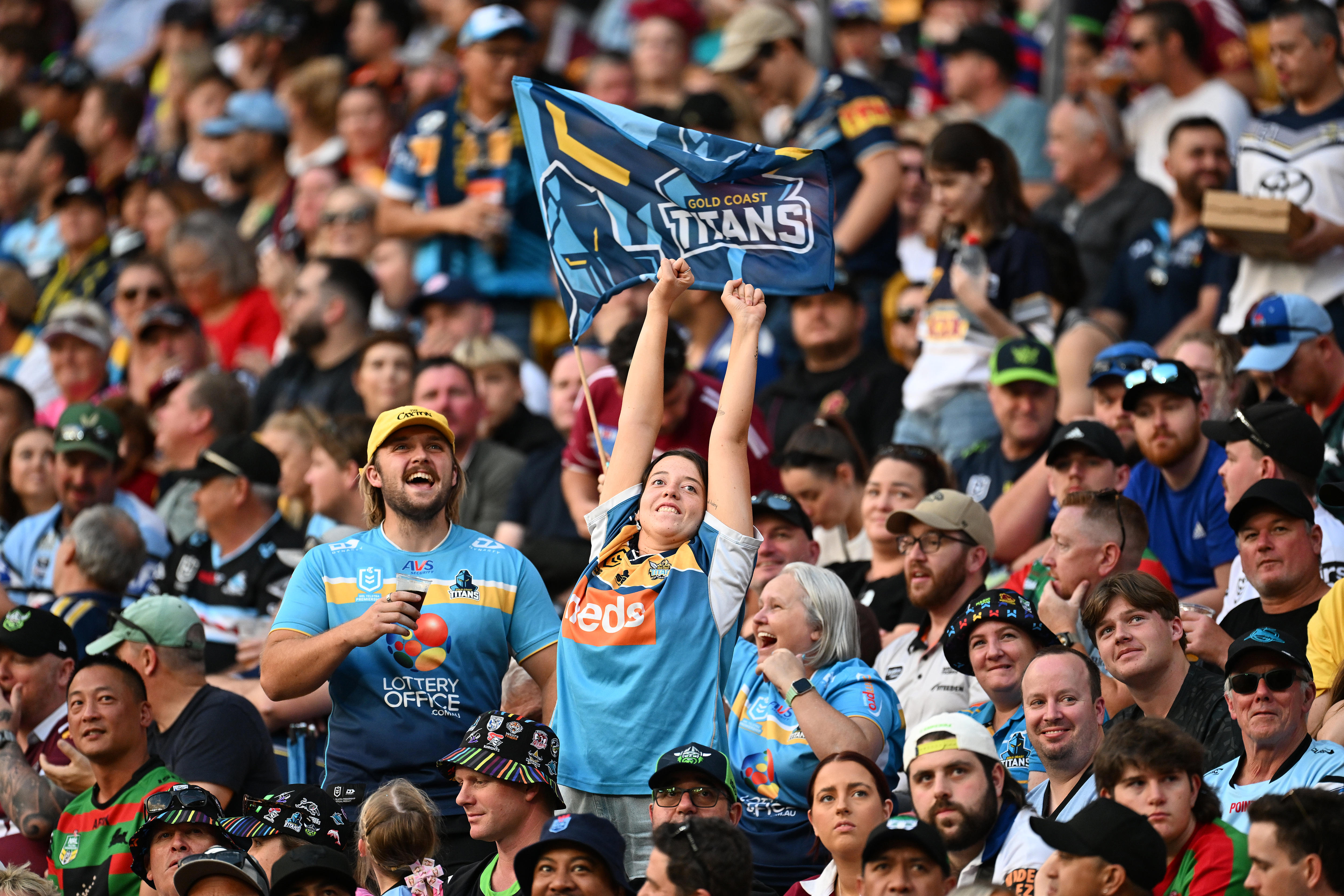Two fans cheer during the NRL's Magic Round 
