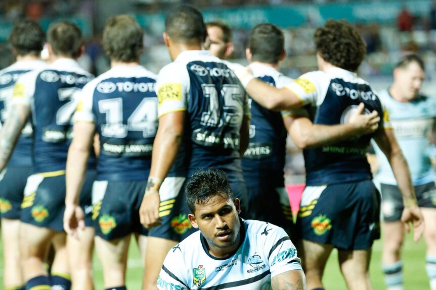 Cronulla's Ben Barba looks on after North Queensland scores another try