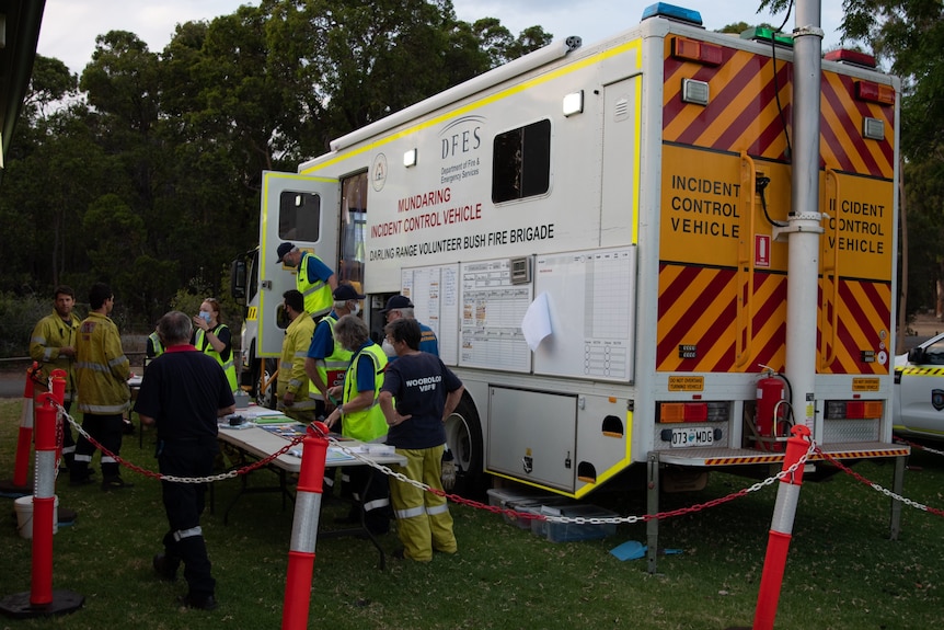 firefighters at an incident control post