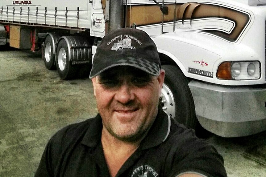 Craig Crampden from Crampo's Transport in Urunga stands in front of one of his B-Doubles ahead of a long haul trip.