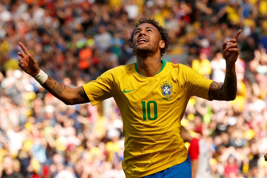 Brazil's Neymar celebrates scoring their first goal against Croatia at Anfield.