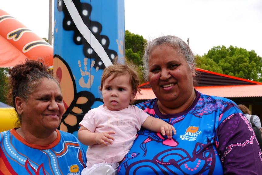 Two women with a babt