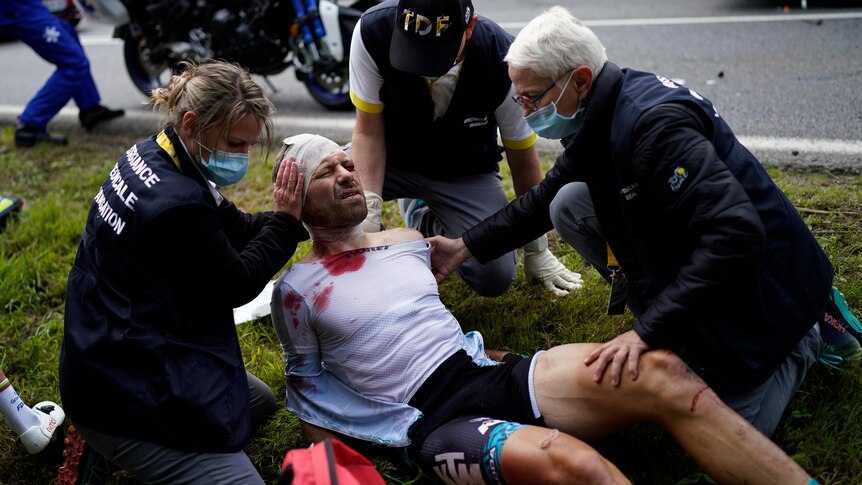 Fan holding sign causes massive Tour de France crash