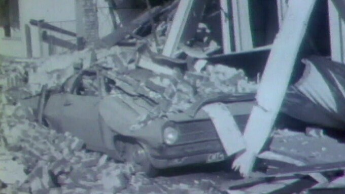 Car crushed under rubble