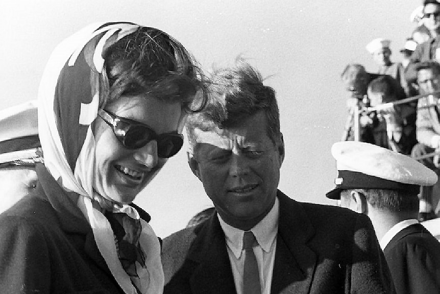 Former president John F Kennedy with wife Jackie Kennedy looking at a ship model during the 1962 America's Cup