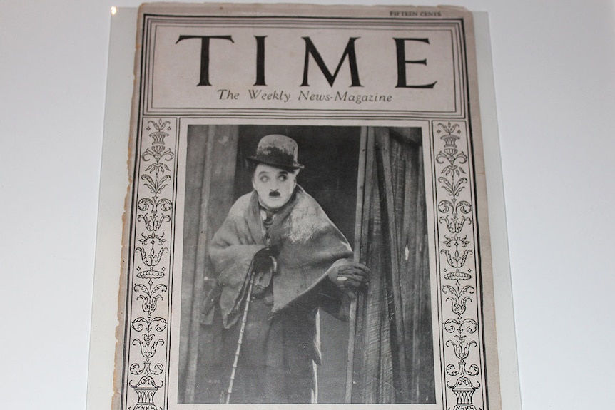 Old black and white TIME magazine with Charlie Chaplin on the cover.