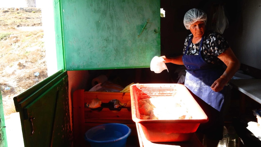 Maria in Kos, greece makes bread by hand