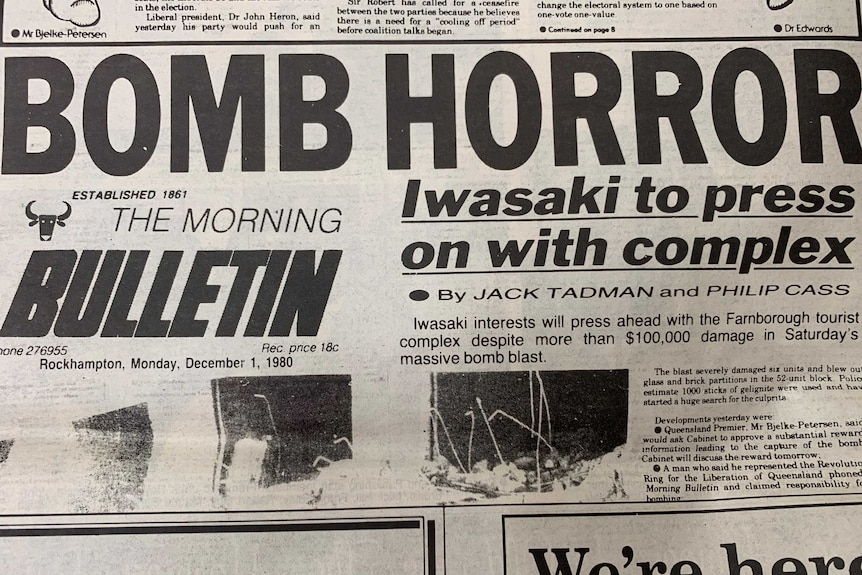 Newspaper clipping, headline reads BOMB HORROR: Iwasaki to press on with complex.