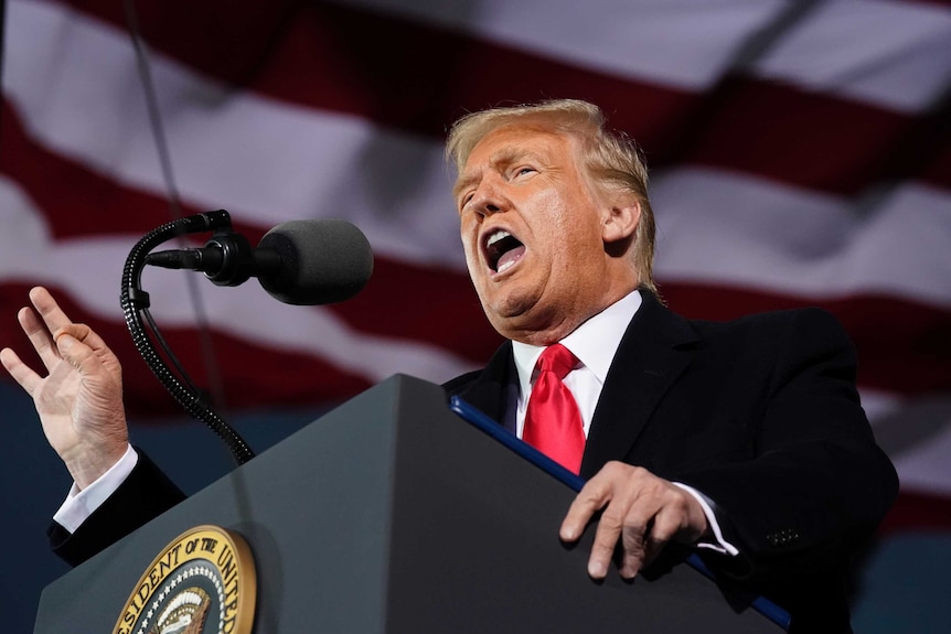 President Donald Trump speaks at a campaign rally at Des Moines International Airport