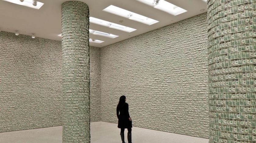 The 100,000 $1 bills blanket nine walls in the famous museum.