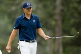 Jordan Spieth crosses the green in the last round of the Masters