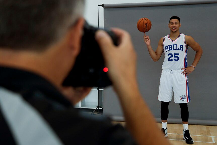 Ben Simmons poses for a photo in Philadelphia gear.