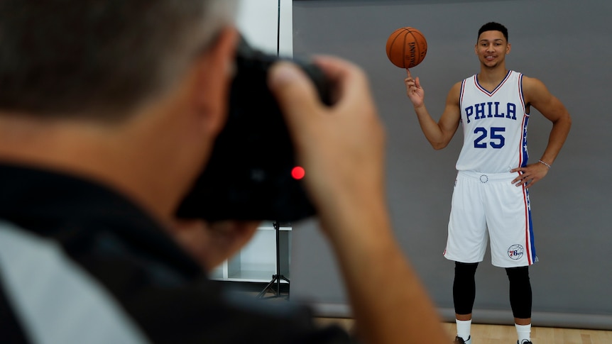 Ben Simmons poses for a photo in Philadelphia gear