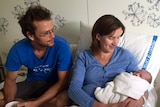 Lars and Jennifer Andersson with their newborn daughter.