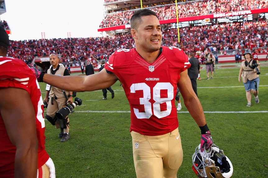 Jarryd Hayne walks off after 49ers win over Ravens