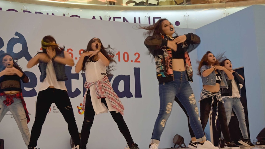 Indonesian girls perform a K-pop dance routine.