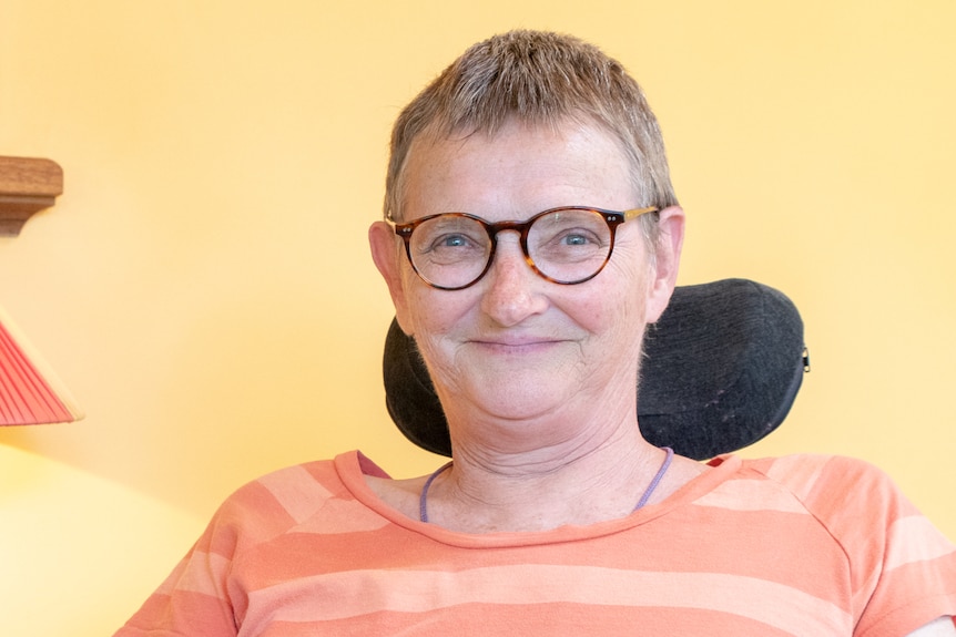 Glenda Lee sits in a mobility scooter.