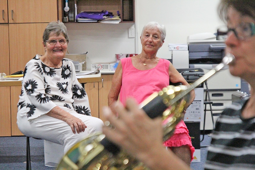 Life members Joy Connelly and Bronwyn Feltham watch the Gold Coast City Wind Orchestra