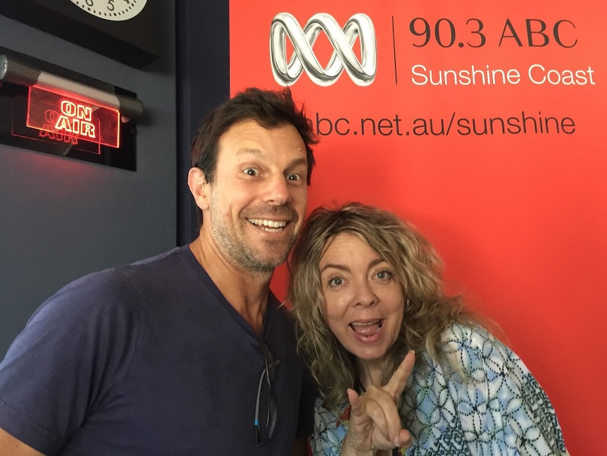 Man and woman smiling in ABC Sunshine Coast studio