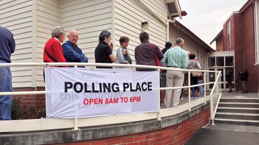Voters queue outside a polling booth in the Hobart seat of Franklin