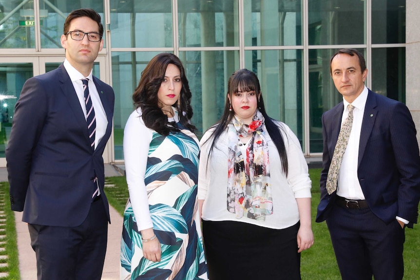 Josh Burns, Nicole Meyer, Dassi Erlich and Dave Sharma stand in a courtyard at Parliament House