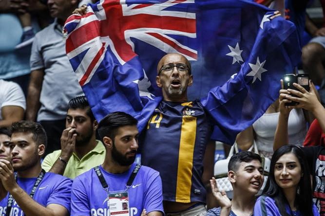 Osman holds an Australian  flag above his head at the Basketball FIBA Asian Cup basketball tournament in Beirut in 2017.