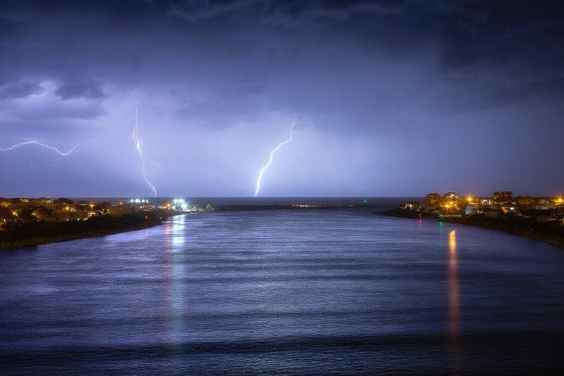 Lightning strikes over a purple sky south of Perth.