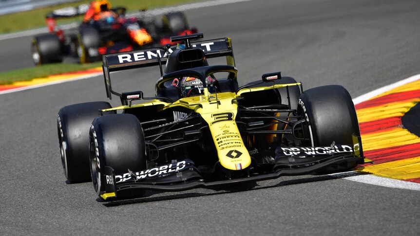Daniel Ricciardo drives a yellow formula 1 car