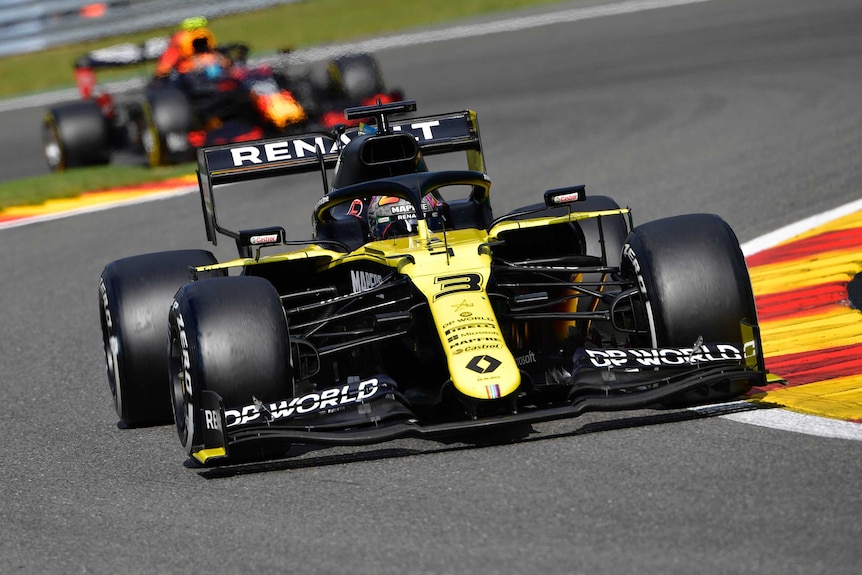 Daniel Ricciardo drives a yellow formula 1 car