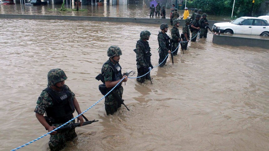 Members of the Mexican Navy secure a flooded area in Acapulco.