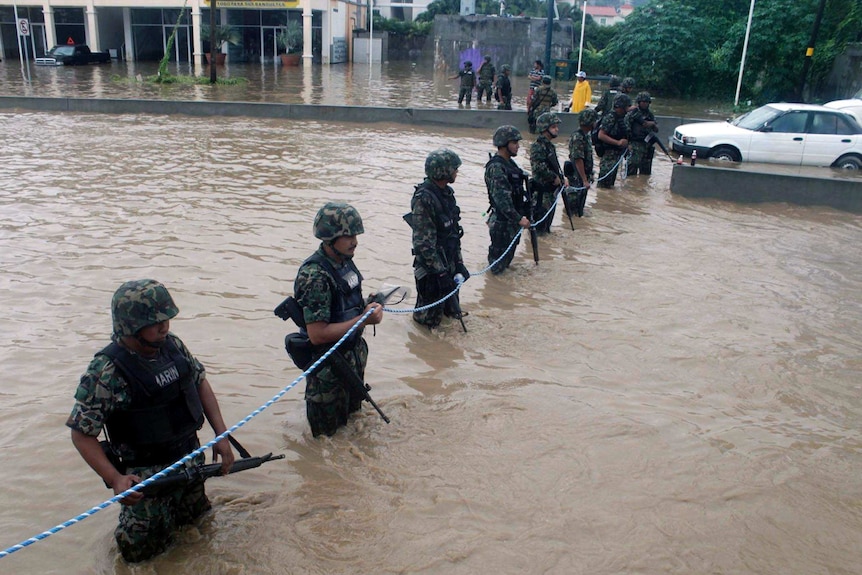 Members of the Mexican Navy secure a flooded area in Acapulco.