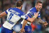 Trent Hodkinson (R) celebrates after kicking the winning field goal for Canterbury over Manly