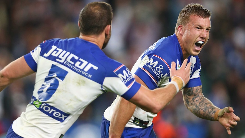 Trent Hodkinson (R) celebrates after kicking the winning field goal for Canterbury over Manly