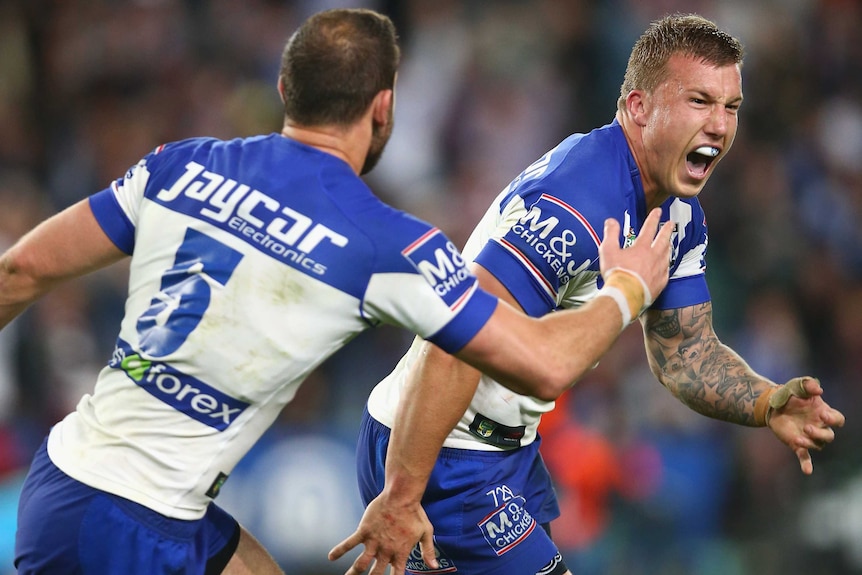 Trent Hodkinson (R) celebrates after kicking the winning field goal for Canterbury over Manly