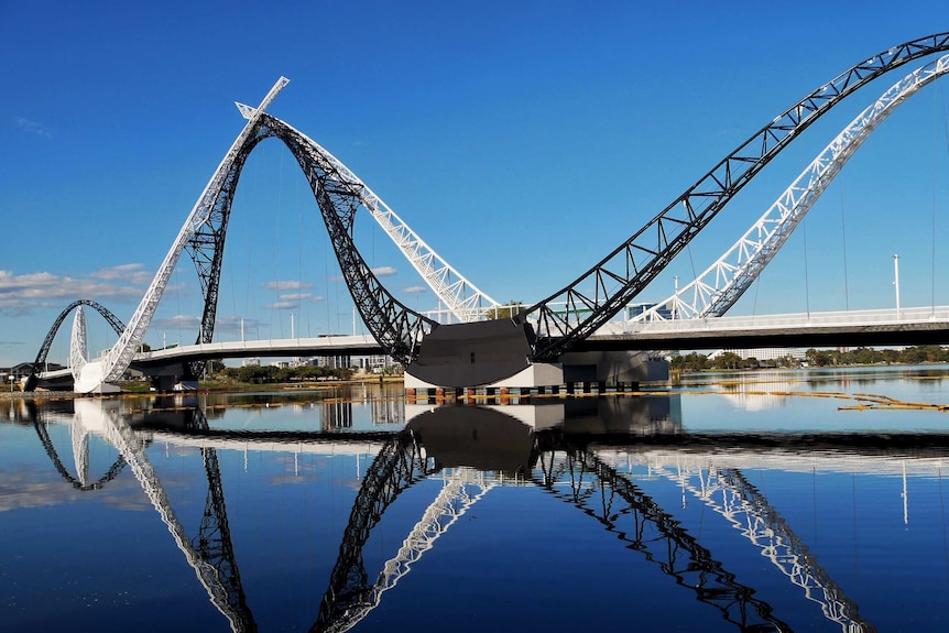 Matagarup Bridge, with its reflection showing in the river.