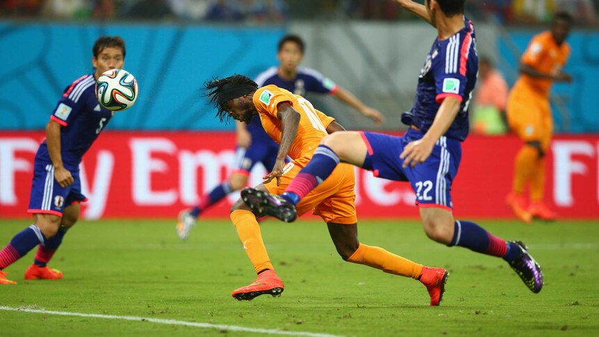 Gervinho scores for the Ivory Coast against Japan in Recife.