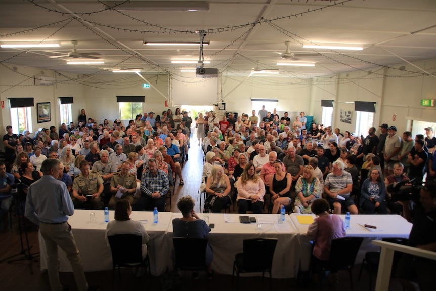 Hundreds of residents packed inside the Currarong Progress Hall with a panel of speakers in front