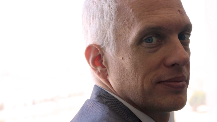A tight head shot of Ryan Gravel looking back over his shoulder.