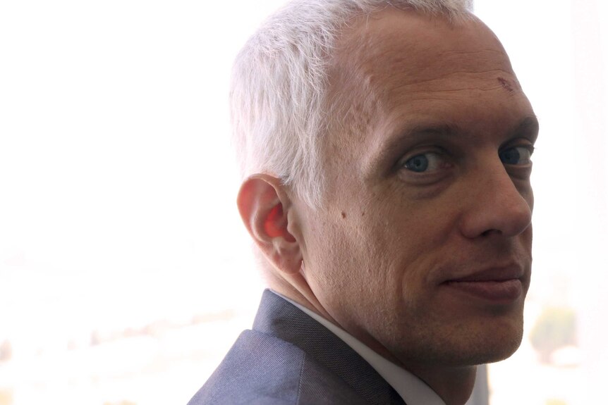 A tight head shot of Ryan Gravel looking back over his shoulder.