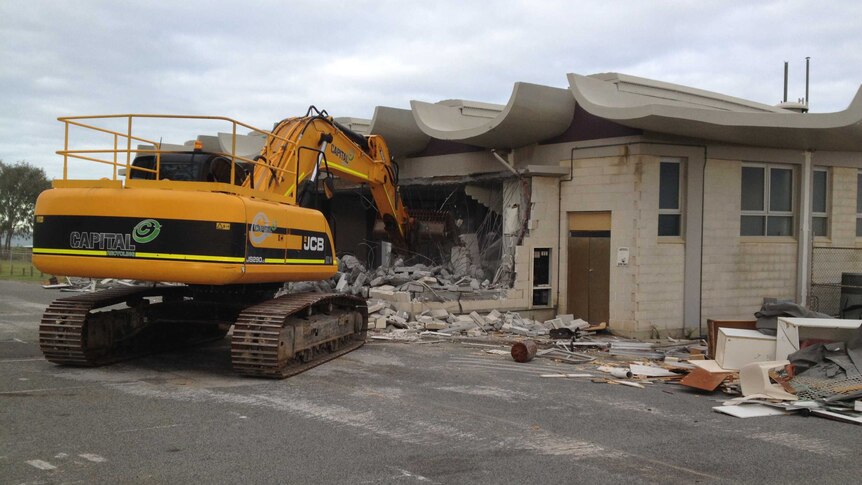 The City Beach surf lifesaving club is demolished by an excavator in Perth, July 04, 2014