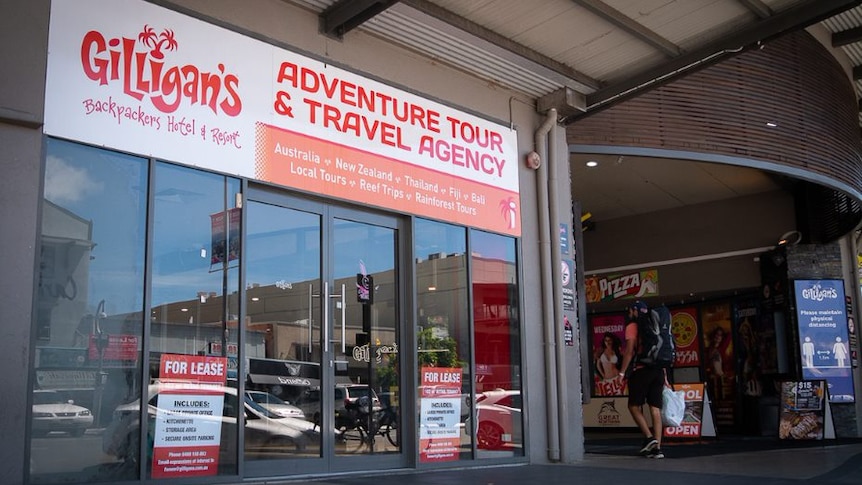 Gilligan's tour and travel agency store front up for lease.