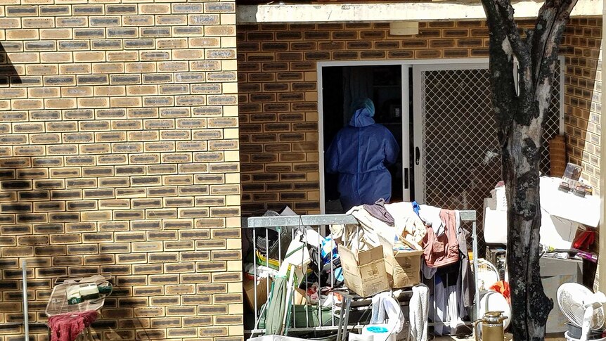 Forensic officers searching an apartment at Kangaroo Point.