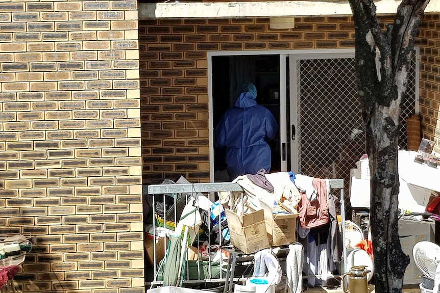 Forensic officers searching an apartment at Kangaroo Point.