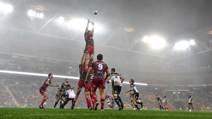 The Reds' Rob Simmonds in the line out as the fog rolls in as Reds play the Brumbies at Lang Park.