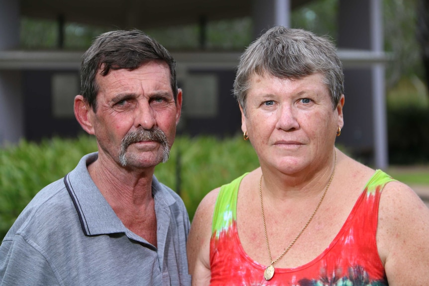 Medium close up of Ray and Pam Palmer posing for a photo. Interviewed for 7.30, March 2018.