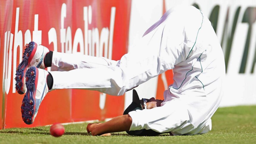 South African fielder Robin Peterson hits the ground