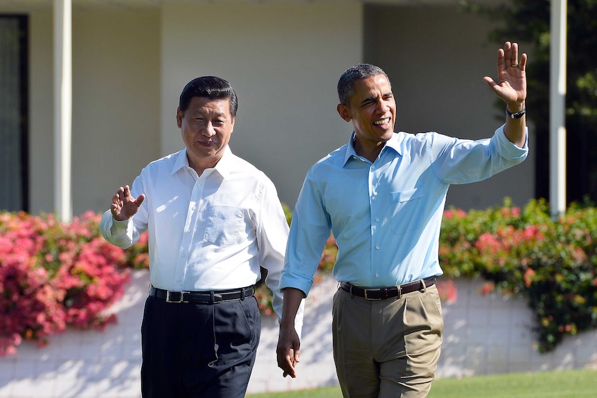 Xi Jinping and Barack Obama wave as they talk a walk at the Annenberg Retreat at Sunnylands