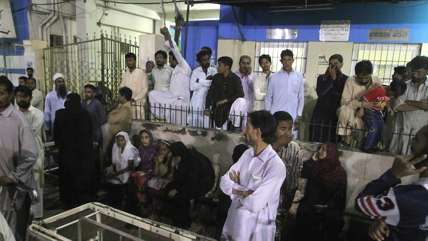 People gathered outside an emergency ward of a hospital in Karachi, Pakistan.