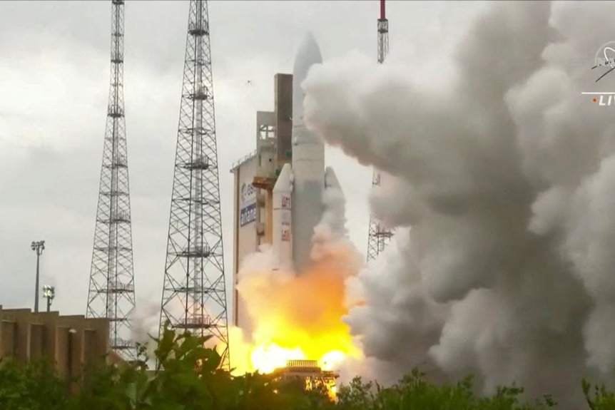 Live footage of Ariane 5 rocket taking off with clouds on right side of launcher