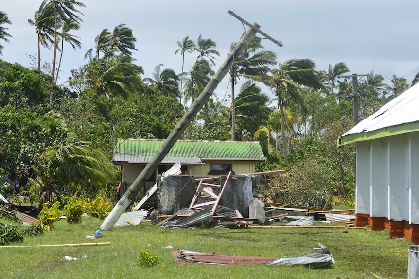 A power pole leans on its side after Tropical Cyclone Winston hits Fiji.
